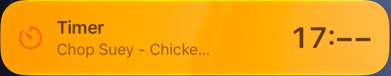 The timer as a Live Activity on the Lock Screen: Timer, Chop Suey, Chicken Stir Fry.